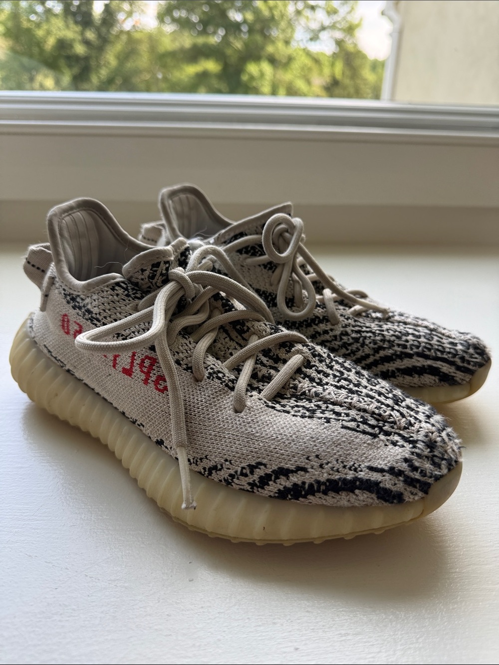 Yeezy Kids Zebra Knit Sneakers in Cream, Black with Red Accent